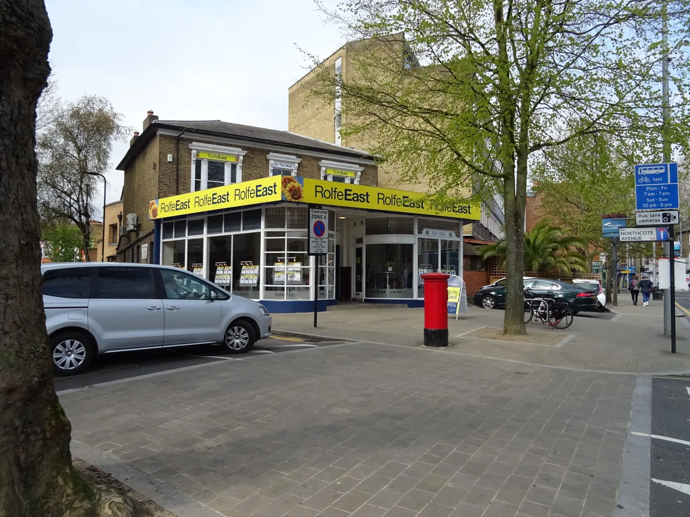 Estate agents on The Mall in Ealing. The UK House Price Index is built from completed Land Registry sales, not from asking prices.